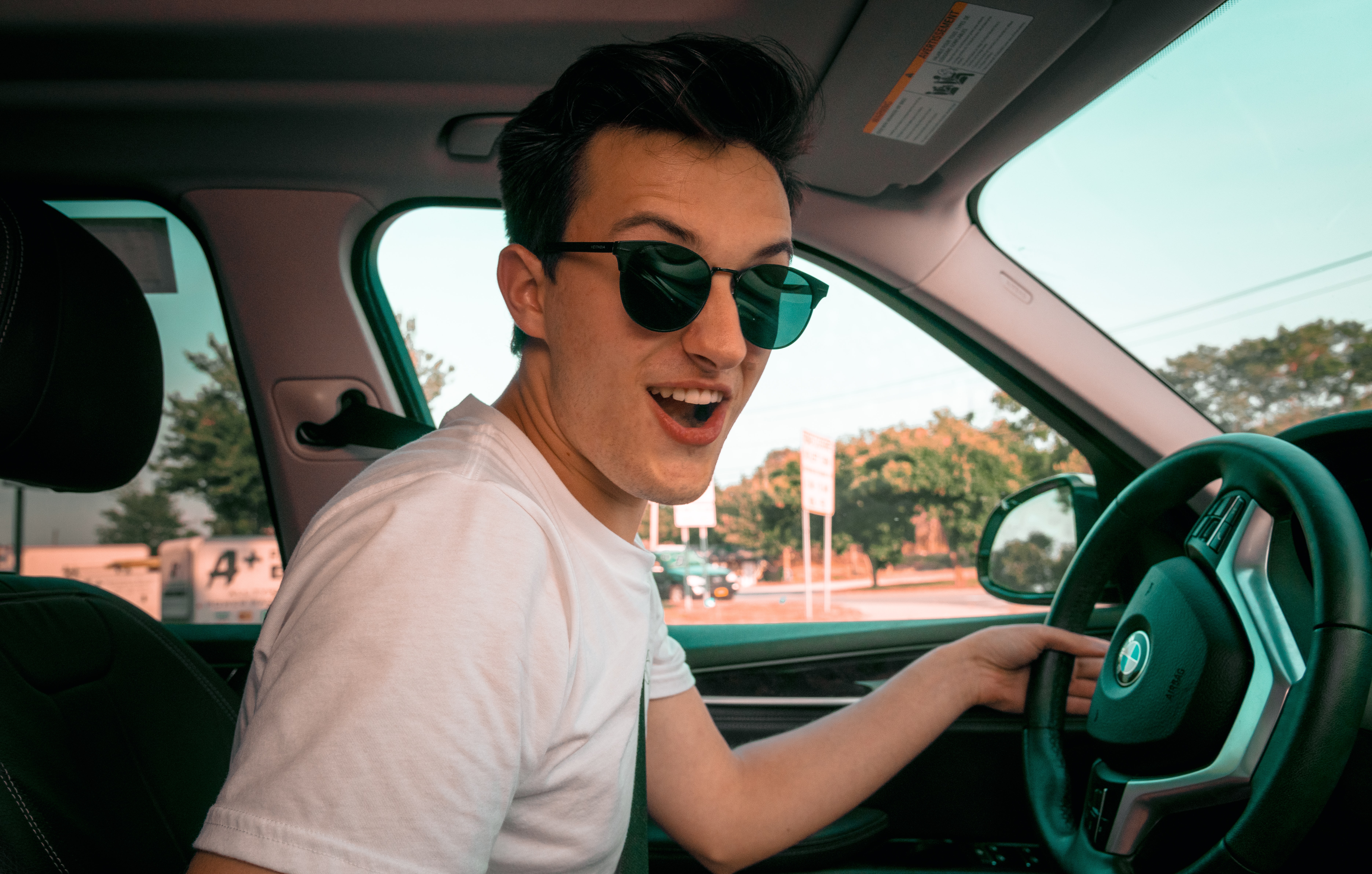 Teen driving a car
